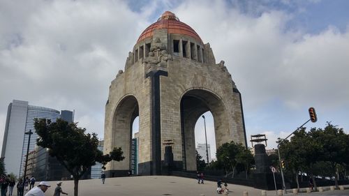 Low angle view of historical building against cloudy sky