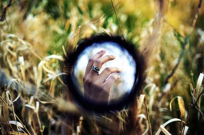 Close-up of person in field