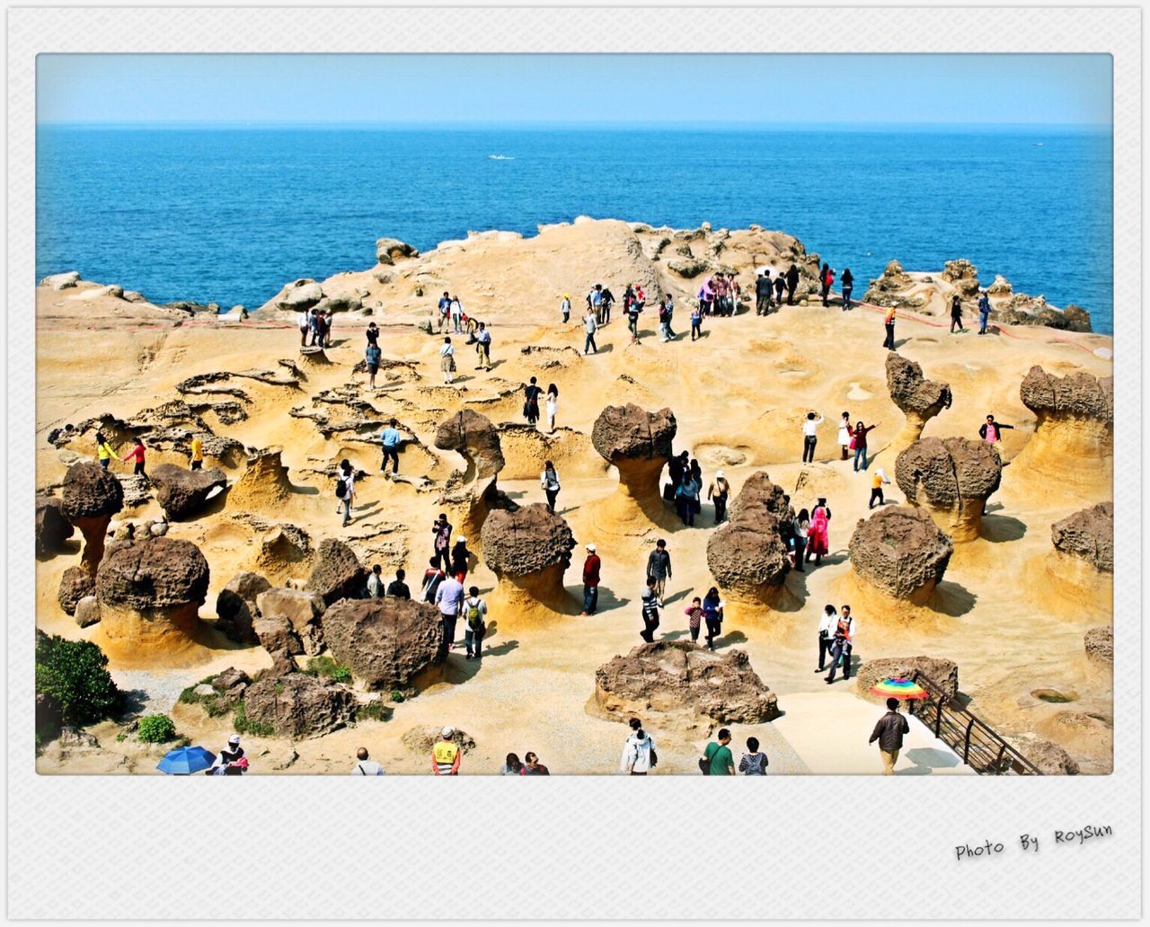 HIGH ANGLE VIEW OF TOURISTS ON BEACH