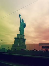 Low angle view of statue against cloudy sky