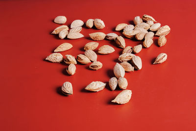 High angle view of carving on table against red background