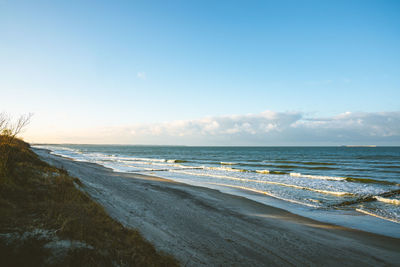 Scenic view of beach against sky