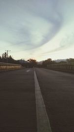 Surface level of empty road against sky