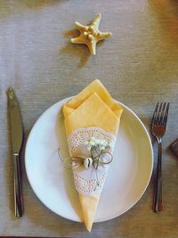 Close-up of bread in plate on table