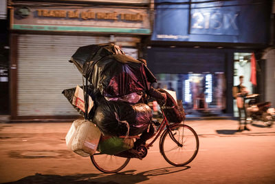 Horse riding bicycle on street