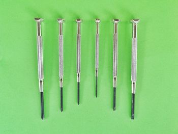 High angle view of green metal against colored background