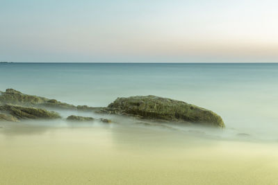 Scenic view of calm sea against clear sky