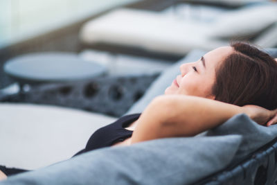 High angle view of woman lying on bed at home