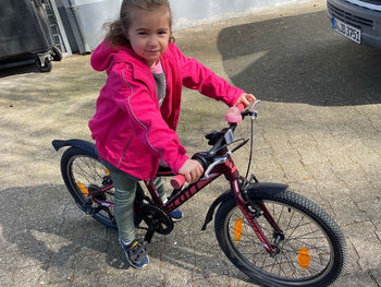 Portrait of girl riding bicycle