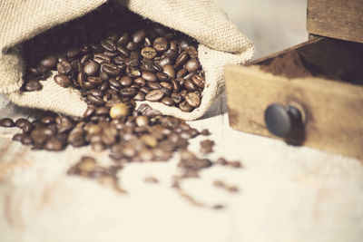 Close-up of roasted coffee beans on table