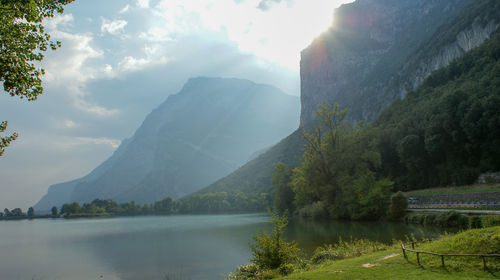 Scenic view of lake and mountains against sky