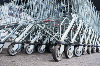 Many empty shopping carts on the shop parking