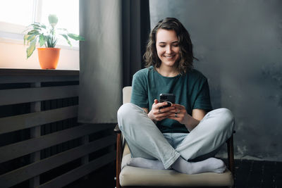 Young woman using mobile phone