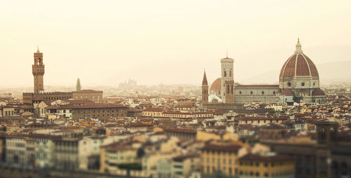 Golden sunset of palazzo vecchio and cathedral of santa maria del fiore, florence, italy.