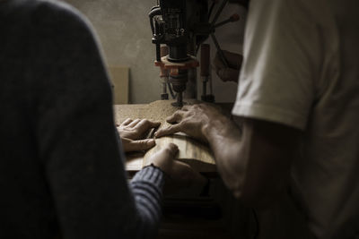 Midsection of man working in office