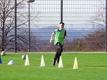 Boy playing soccer on field