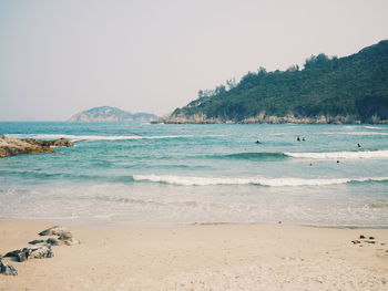 Scenic view of beach against clear sky