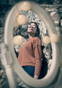 Portrait of young woman with reflection