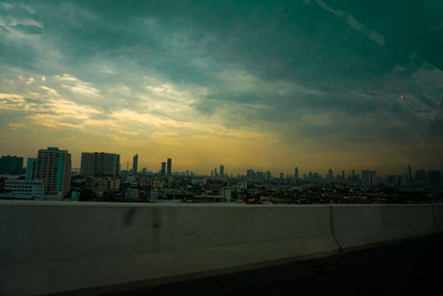 Cityscape against sky during sunset