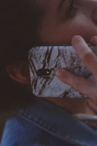 Close-up of woman using mobile phone