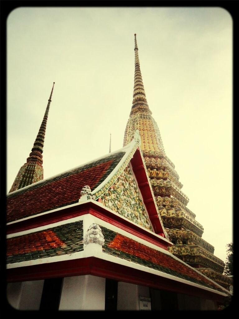 architecture, low angle view, building exterior, built structure, religion, place of worship, spirituality, transfer print, tower, sky, auto post production filter, spire, clear sky, tall - high, church, high section, steeple, city, famous place