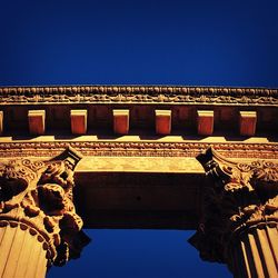 Low angle view of built structure against blue sky