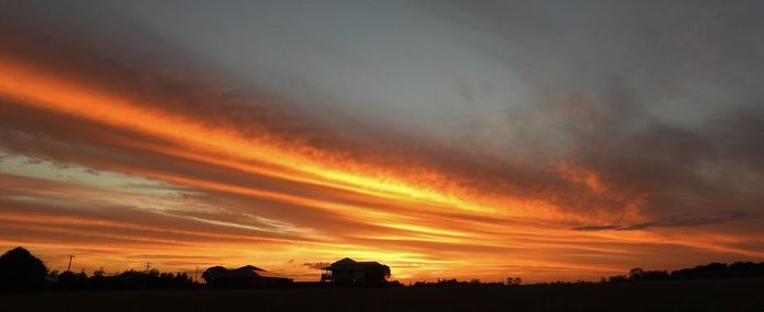 Scenic view of dramatic sky during sunset