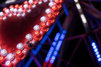 Low angle view of illuminated lanterns hanging at night