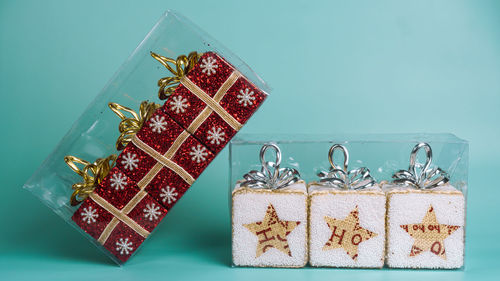 Christmas decorations on table against gray background