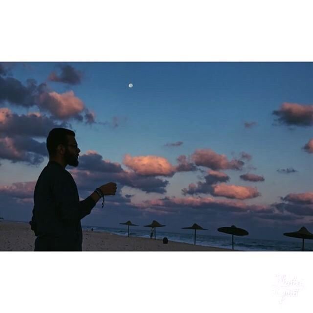 cloud - sky, sky, silhouette, real people, one person, sunset, outdoors, nature, leisure activity, scenics, standing, women, lifestyles, men, beauty in nature, beach, technology, day, people