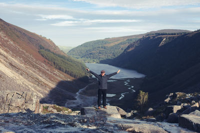 Man on mountain against sky