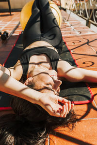 Low section of woman sitting on table