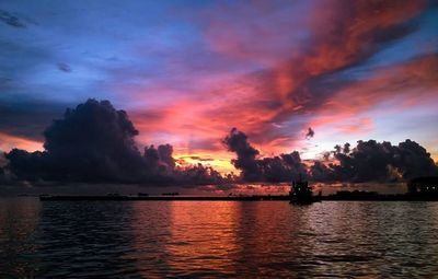 Scenic view of dramatic sky at sunset