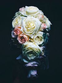 Close-up of rose bouquet against black background