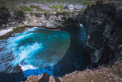 High angle view of rocks in sea