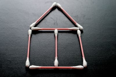 House shape made cotton swab on table