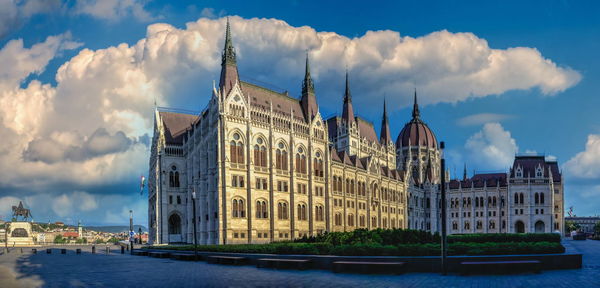 Parliament building on the embankment of budapest, hungary, on a sunny summer morning