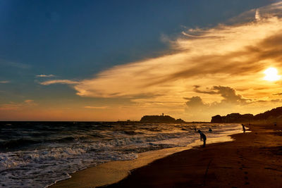 Scenic view of sea against romantic sky during sunset