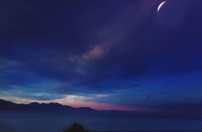 Scenic view of sea against sky at sunset