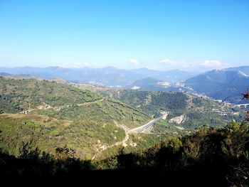 Scenic view of landscape against blue sky