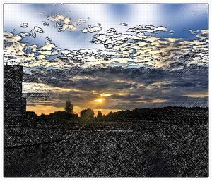 Scenic view of landscape against sky at sunset