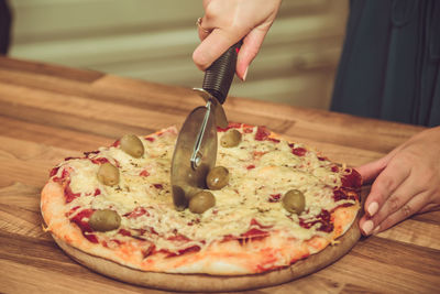 Midsection of person preparing food on table