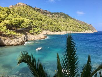 Scenic view of sea against blue sky