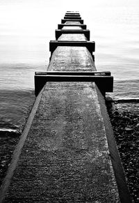 View of built structure by sea against sky