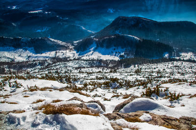 Snow covered land and mountains