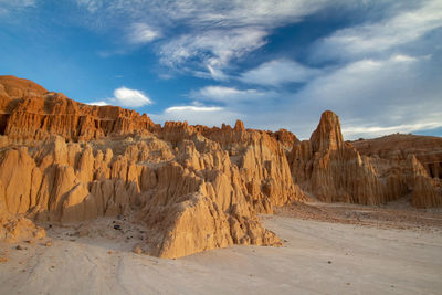 Panoramic view of arid landscape against sky