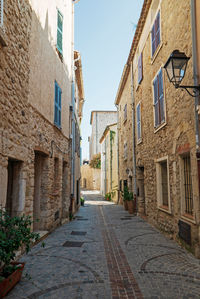 Narrow street amidst buildings in town