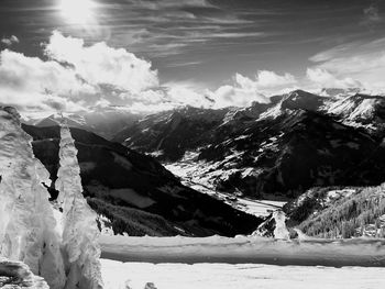 Scenic view of snow covered mountains against sky