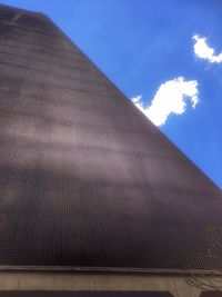 Low angle view of building against blue sky