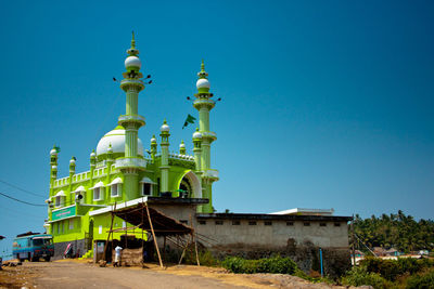 Low angle view of church against clear blue sky